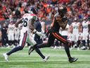 B.C. Lions' Justin McInnis scores a touchdown past Montreal Alouettes' Tyrice Beverette Aug. 16 in Vancouver.