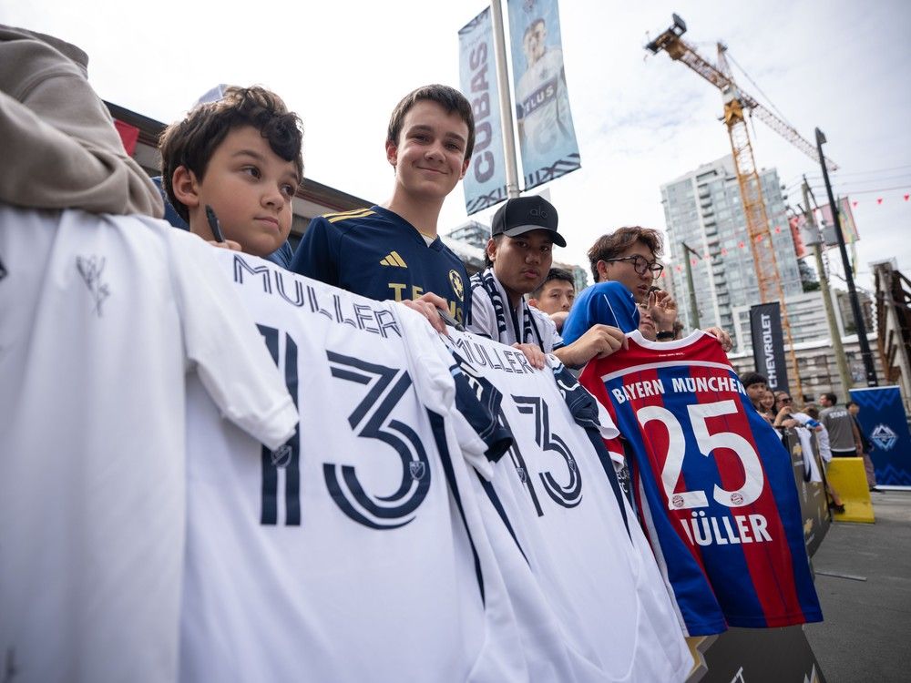 Fans wait for Vancouver Whitecaps' Thomas Muller before an MLS soccer match in Vancouver, B.C., Sunday, Aug. 17, 2025.