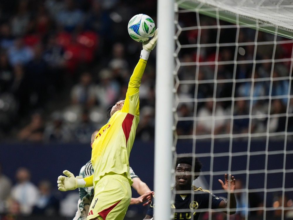 Vancouver Whitecaps' goalkeeper Yohei Takaoka makes a save off a corner kick during the first half of an MLS soccer match against the Portland Timbers, in Vancouver, on Wednesday, September 24, 2025.