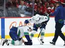 Filip Chytil lays on the ice after being checked by Tom Wilson of the Washington Capitals on Sunday.