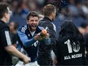 Vancouver Whitecaps' Thomas Muller sprays a camera person after defeating Vancouver FC in the Canadian Championship final soccer match in Vancouver, October 1.