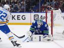 Kevin Lankinen makes a save on pinching Blues' defenceman Justin Faulk on Monday at Rogers Arena.