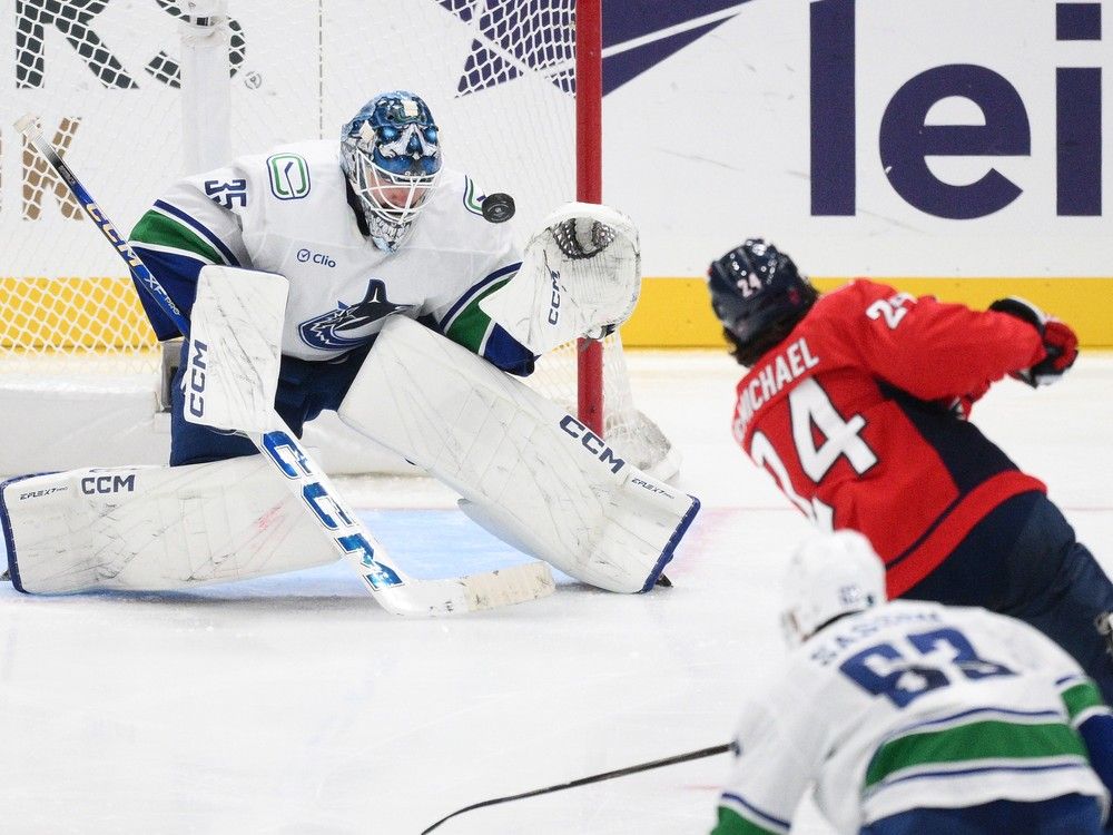 Vancouver Canucks goaltender Thatcher Demko denies Capitals centre Connor McMichael during third period Sunday in Washington, D.C. McMichael had six shots and no goals.