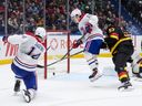 Montreal Canadiens' Nick Suzuki scores into the open net behind Canucks goalie Kevin Lankinen on Saturday.