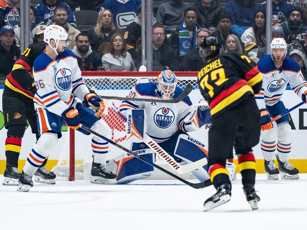 Canucks centre Lukas Reichel unloads during a matchup against Edmonton Oilers on Sunday at Rogers Arena.