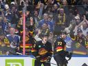 Canucks fans cheer after Filip Chytil scores against the Calgary Flames on Oct. 9.
