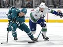 William Eklund of the San Jose Sharks and David Kampf of the Vancouver Canucks during Nov. 28 game in San Jose, California.