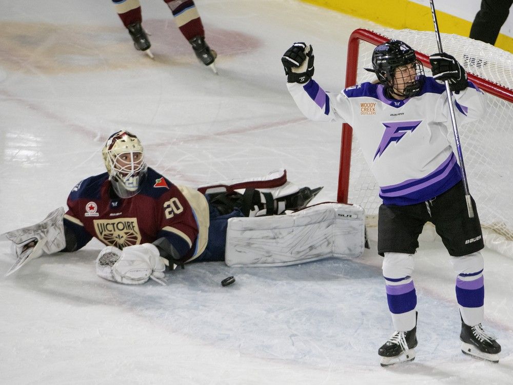 Minnesota Frost Denisa Krizova (41) celebrates after scoring on Montreal Victoire Elaine Chuli (20) to cement the victory for her team during third period PWHL hockey action in Laval, Que. Tuesday Feb. 18, 2025.
