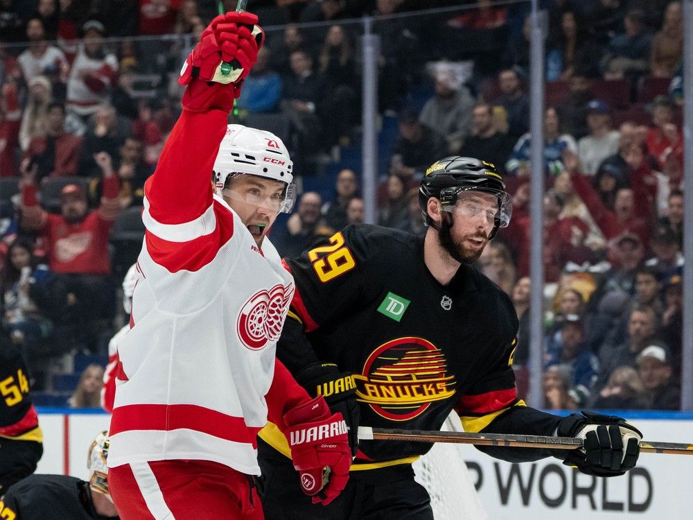Detroit Red Wings' James van Riemsdyk (21) celebrates his goal as Marcus Pettersson (29) skates away during the first period at Rogers Arena on Monday night