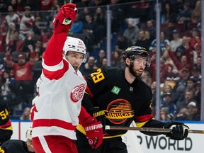 Detroit Red Wings' James van Riemsdyk (21) celebrates his goal as Marcus Pettersson (29) skates away during the first period at Rogers Arena on Monday night