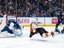 Philadelphia Flyers' Travis Konecny (11) scores on Vancouver Canucks goaltender Thatcher Demko (35) during the second period at Rogers Arena on Tuesday night. The Flyers won 6-3.