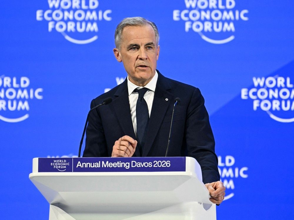 Prime Minister Mark Carney delivers a speech at the World Economic Forum in Davos, Switzerland on Jan. 20, 2026. He received a standing ovation for his remarks and global plaudits. Fabrice Coffrini/AFP