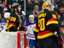 Zach Hyman of the Edmonton Oilers celebrates after scoring a goal on Nikita Tolopilo of the Vancouver Canucks Jan. 17, 2026 in Vancouver.