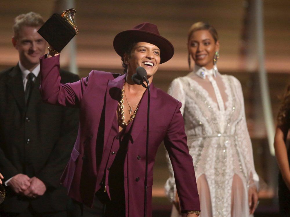 In this Feb. 15, 2016 file photo, Bruno Mars accepts the award for record of the year for his song Uptown Funk at the 58th annual Grammy Awards in Los Angeles.