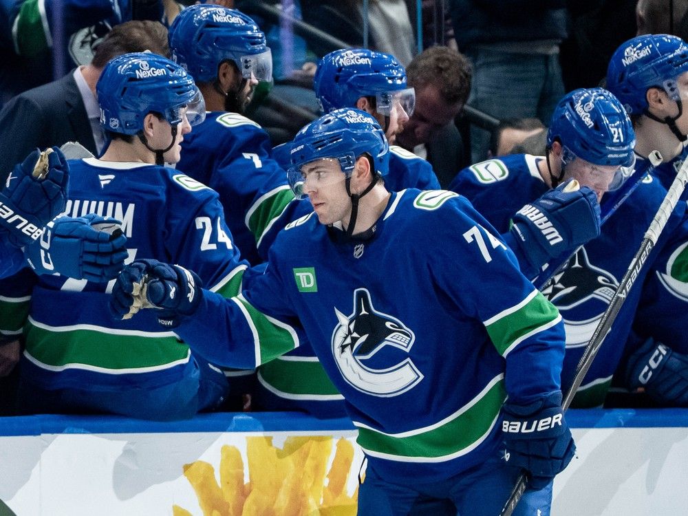 Vancouver Canucks' Jake DeBrusk celebrates his goal against the Seattle Kraken with his teammates during the second period of an NHL game in Vancouver, on Friday, Jan. 2, 2026.