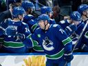 Vancouver Canucks' Jake DeBrusk celebrates his goal against the Seattle Kraken with his teammates during the second period of an NHL game in Vancouver, on Friday, Jan. 2, 2026.