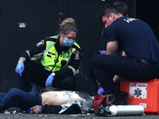 Paramedics and Vancouver firefighters respond to an unconscious patient In the Downtown Eastside recently.