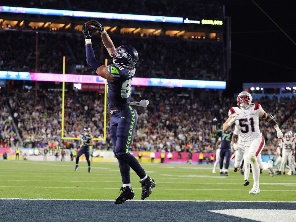 AJ Barner #88 of the Seattle Seahawks scores a touchdown against the New England Patriots during the fourth quarter of Super Bowl LX at Levi's Stadium on February 08, 2026 in Santa Clara, California.