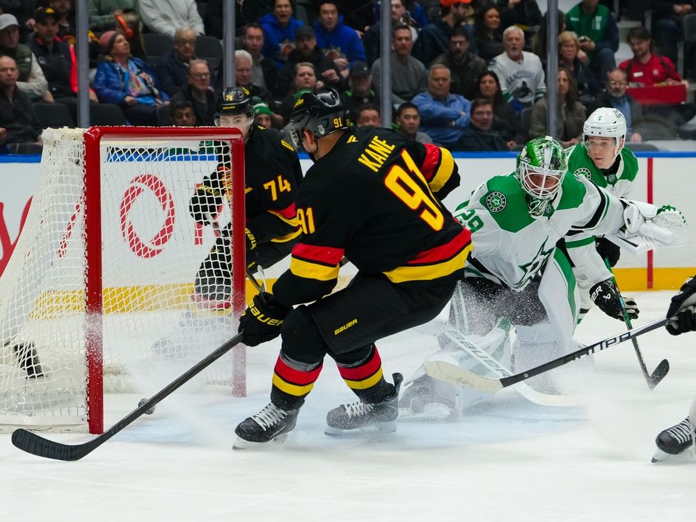 Evander Kane #91 of the Vancouver Canucks scores on Jake Oettinger #29 of the Dallas Stars during the first period at Rogers Arena on March 2, 2026 in Vancouver, British Columbia, Canada.