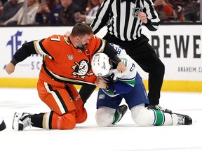 Radko Gudas #7 of the Anaheim Ducks fights Teddy Blueger #53 of the Vancouver Canucks during the first period
