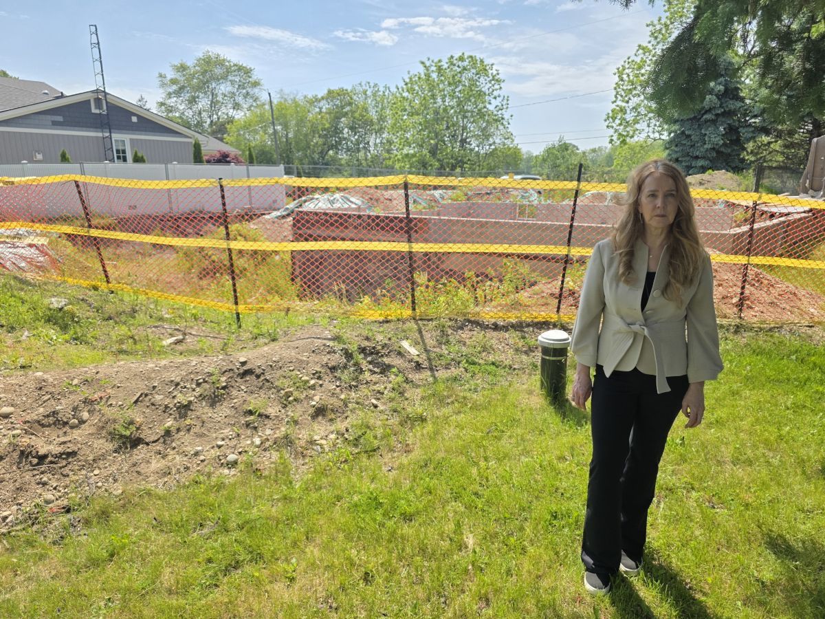 Christine Reio stands in front of the dig site on her property in Wainfleet, Ont.
