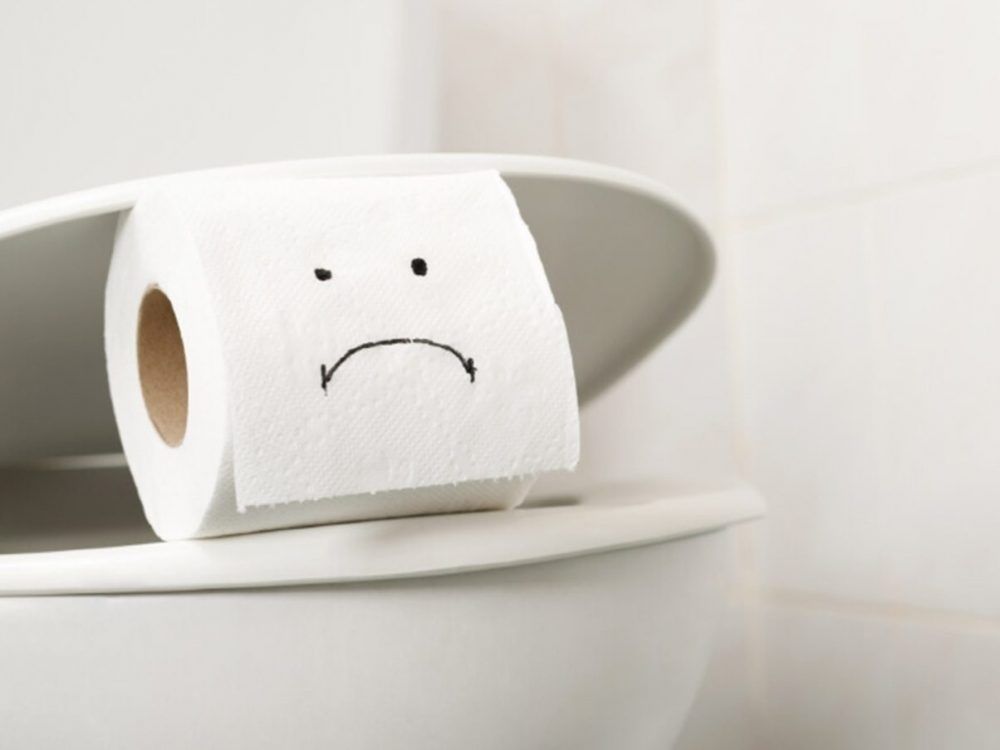 Toilet paper on the toilet bowl at home.