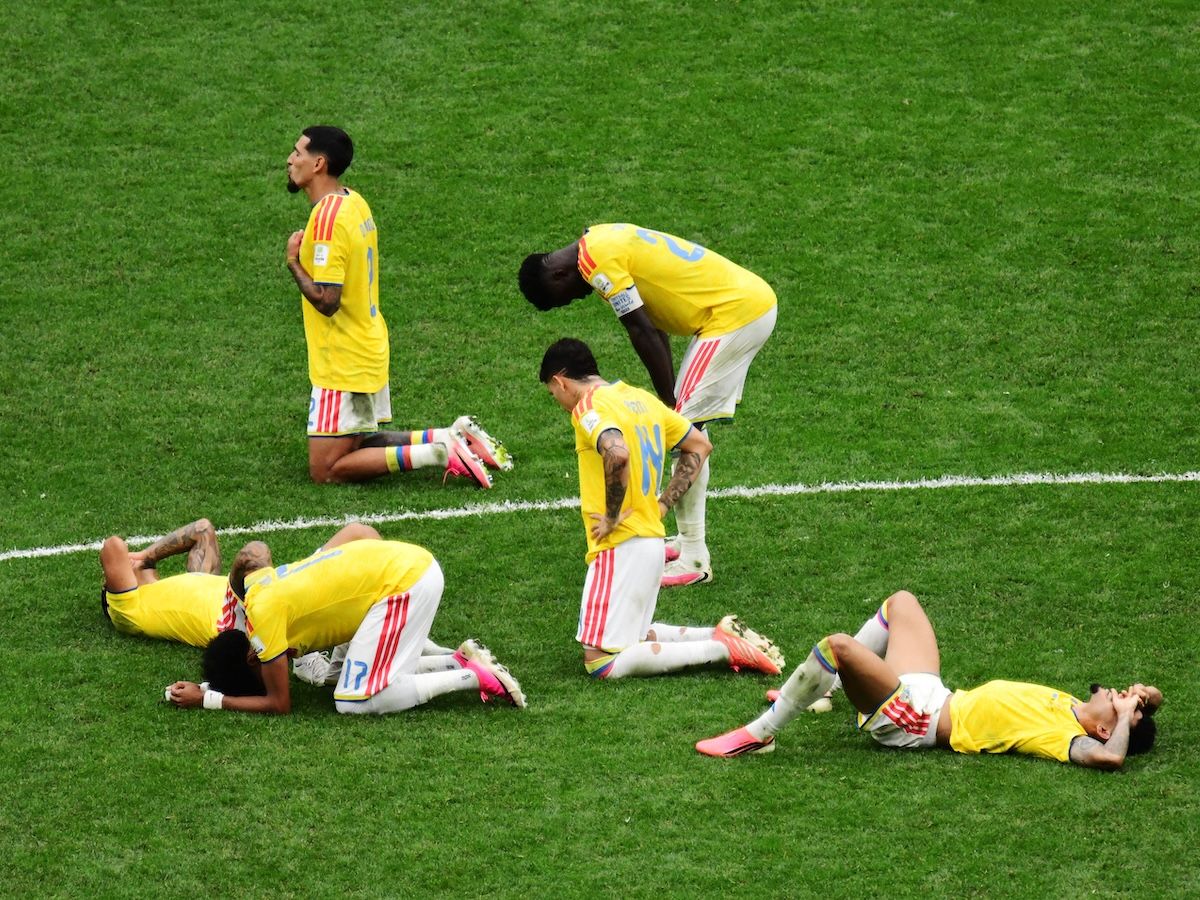 Colombia's players lie in despair on the B.C. Place turf after losing to Switzerland in a shootout during the 2026 World Cup round of 16 football match on Tuesday.
