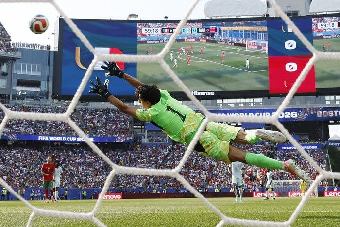 Morocco's goalkeeper #01 Yassine Bounou concedes a goal scored by France's forward #10 Kylian Mbappe (out of frame) and his team's first goal during the 2026 World Cup football tournament quarter-final match between France and Morocco at Boston Stadium in Foxborough on July 9, 2026.