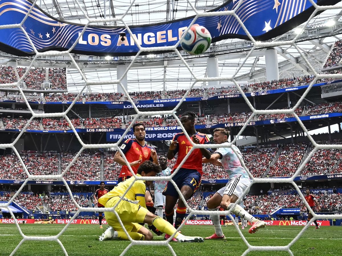 The ball hits the back of the net as viewed from behind