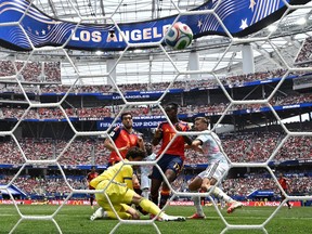 The ball hits the back of the net as viewed from behind