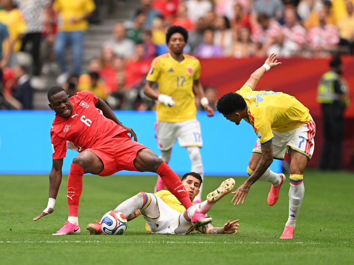 VANCOUVER, CANADA - JULY 07: Denis Zakaria #6 of Switzerland competes for the ball against Gustavo Puerta #14 and Luis Diaz #7 of Colombia during the FIFA World Cup 2026 Round of 16 match between Switzerland and Colombia at BC Place Vancouver on July 07, 2026 in Vancouver, British Columbia, Canada.