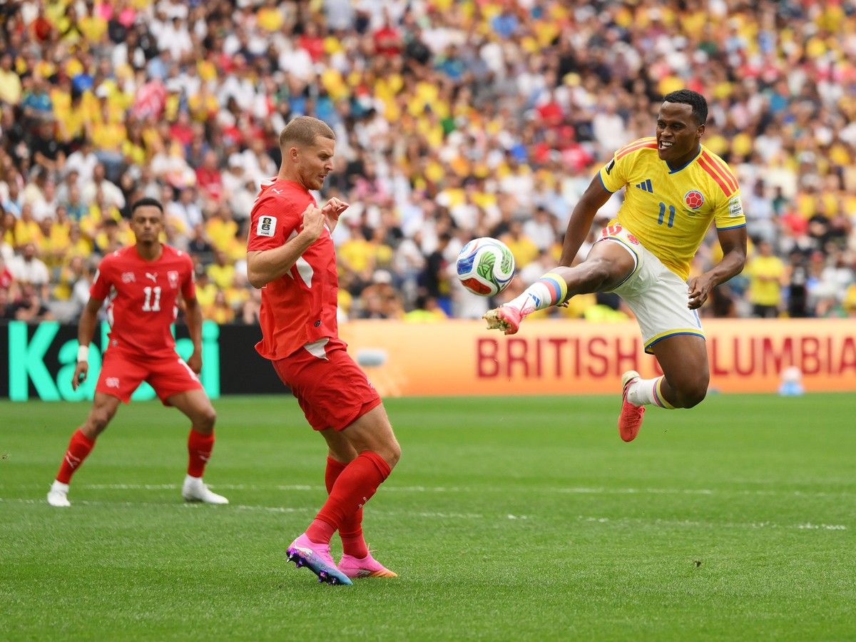 VANCOUVER, CANADA - JULY 07: Nico Elvedi #4 of Switzerland competes for the ball against Jhon Arias #11 of Colombia during the FIFA World Cup 2026 Round of 16 match between Switzerland and Colombia at BC Place Vancouver on July 07, 2026 in Vancouver, British Columbia, Canada.