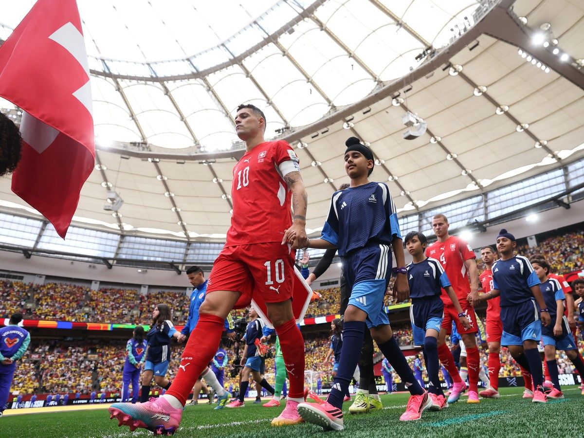 VANCOUVER, CANADA - JULY 07: Captain Granit Xhaka #10 of Switzerland leads the team entering the pitch before the FIFA World Cup 2026 Round of 16 match between Switzerland and Colombia at BC Place Vancouver on July 07, 2026 in Vancouver, British Columbia, Canada.