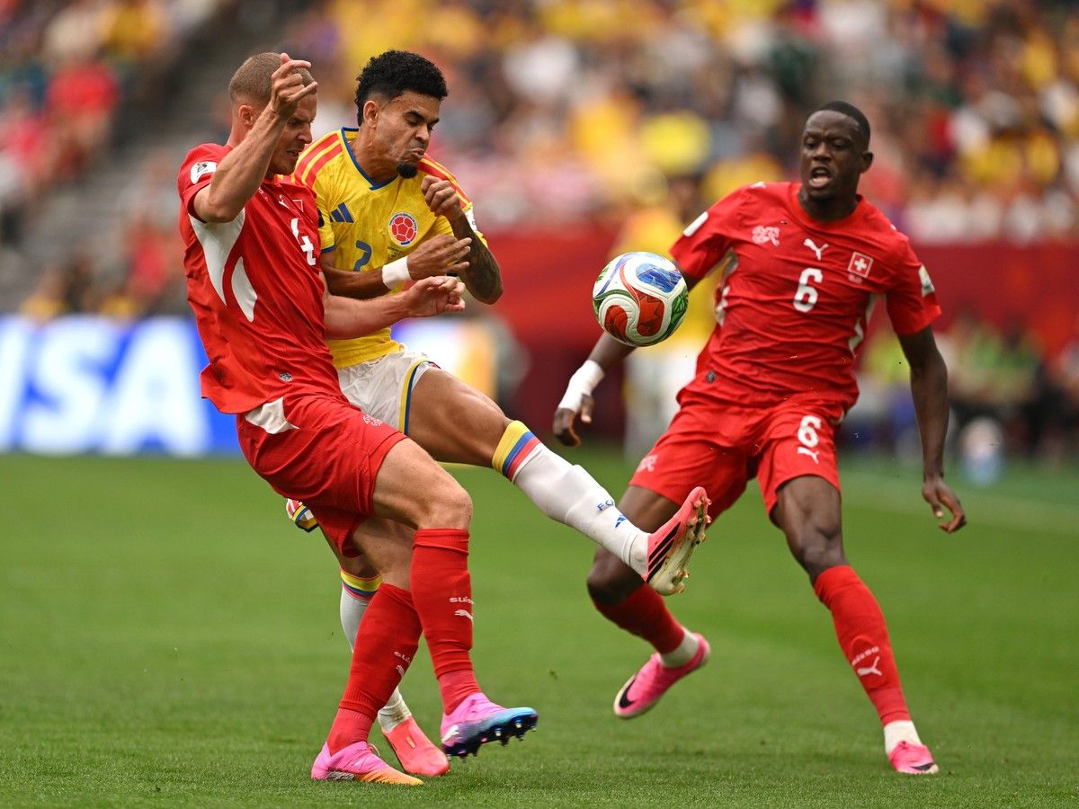 VANCOUVER, CANADA - JULY 07: Luis Diaz #7 of Colombia competes for the ball against Denis Zakaria #6 and Nico Elvedi #4 of Switzerland during the FIFA World Cup 2026 Round of 16 match between Switzerland and Colombia at BC Place Vancouver on July 07, 2026 in Vancouver, British Columbia, Canada.