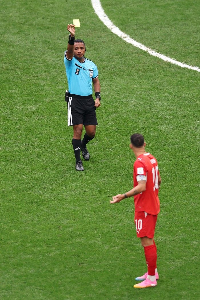 VANCOUVER, CANADA - JULY 07: Granit Xhaka #10 of Switzerland receives a yellow card by Referee Ivan Barton after fouling on Daniel Munoz #2 (not pictured) of Colombia during the FIFA World Cup 2026 Round of 16 match between Switzerland and Colombia at BC Place Vancouver on July 07, 2026 in Vancouver, British Columbia, Canada.
