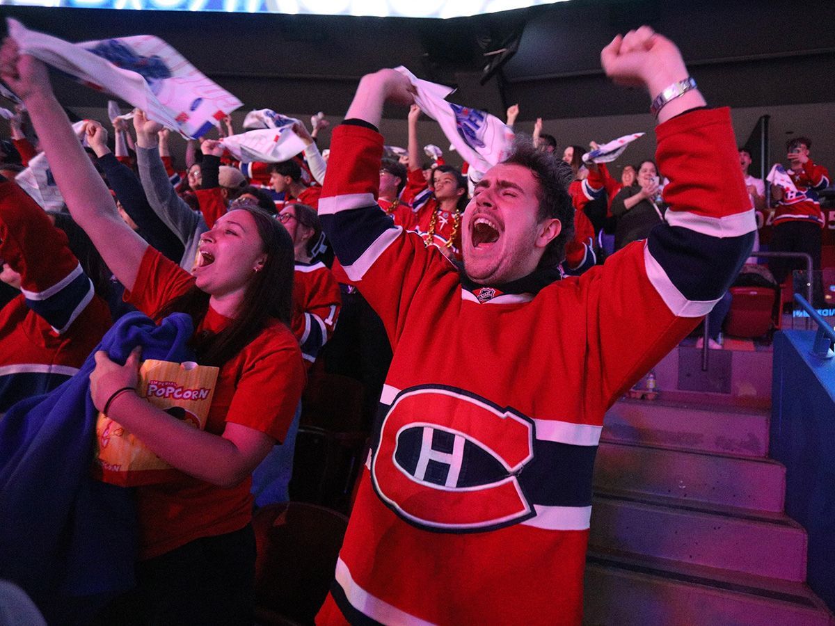 Montreal Canadiens fans at the Bell Centre in Montreal celebrate the team's 2-1 win against the Tampa Bay Lightning in Game 7 of the first round of the Stanley Cup playoffs on Sunday, May 3, 2026. The game was held in Tampa, with the Bell Centre hosting fans for a watch party.