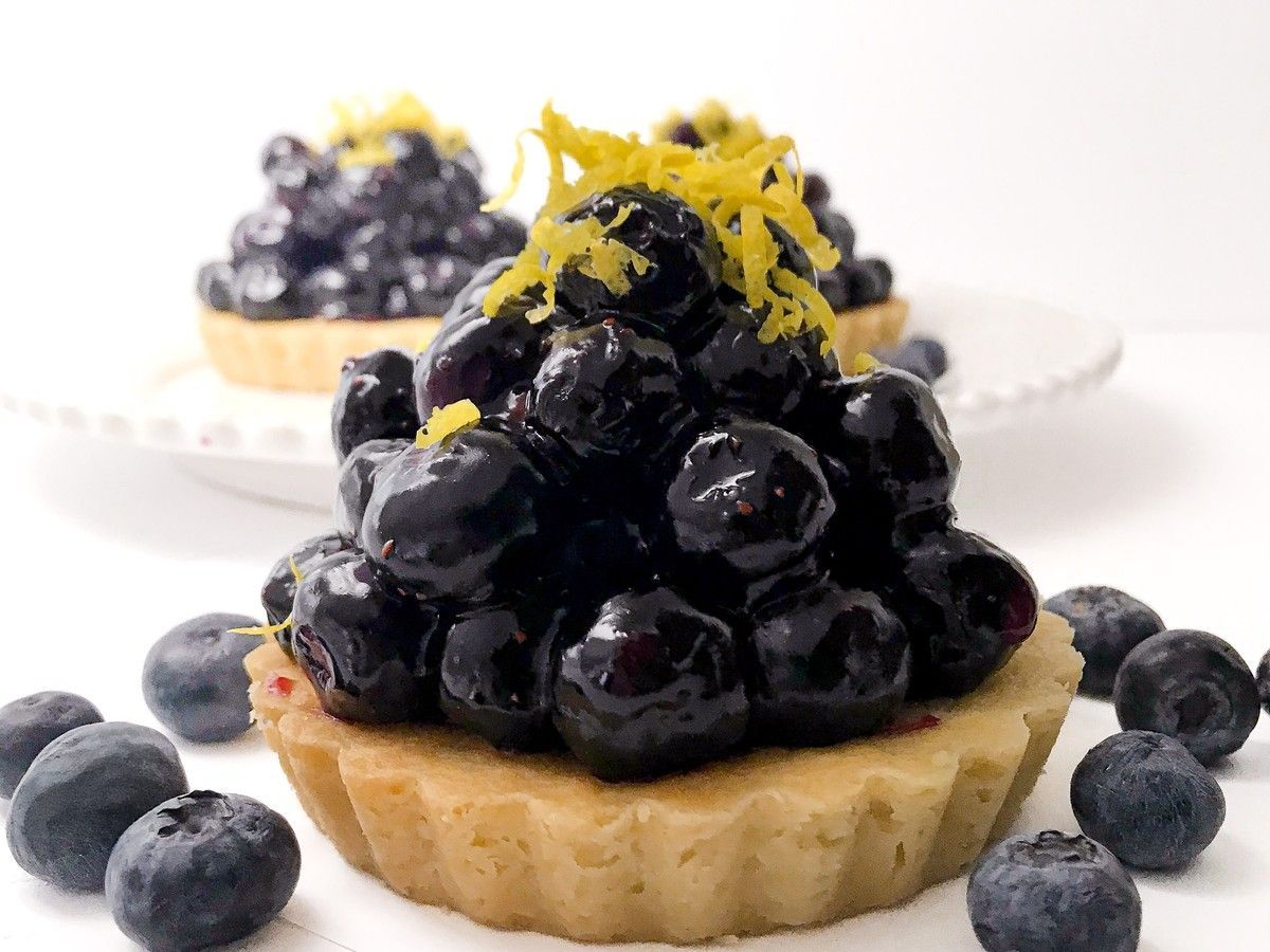 Instead of a traditional pastry crust, this Fresh Blueberry Tarts recipe uses a buttery cookie-style tart shell that gives it a slightly softer, richer bite.