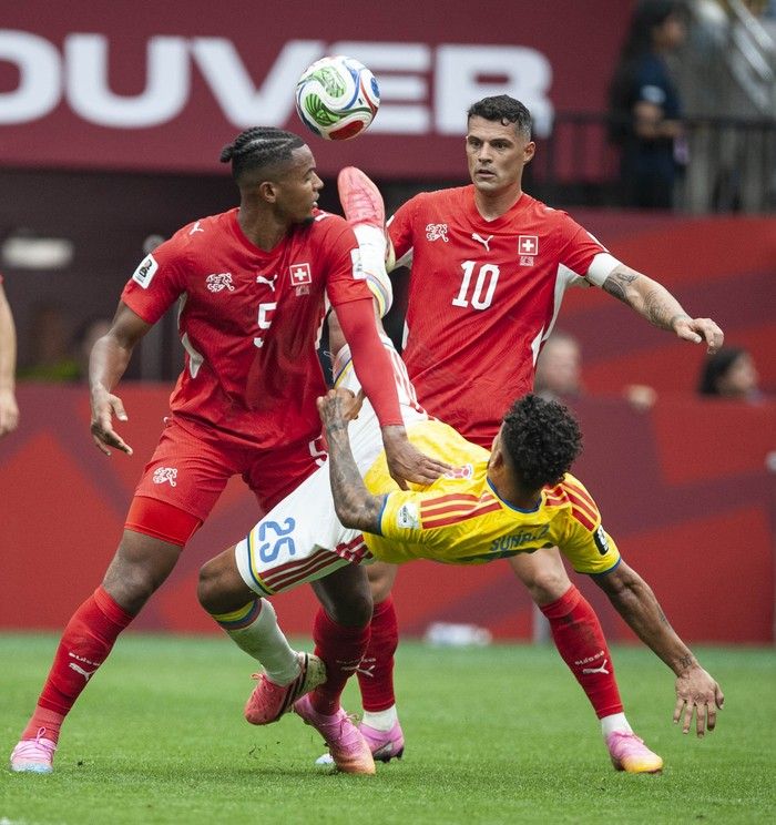 Switzerland's Manuel Akanji (left) and Granit Xhaka fight for the ball with Colombia's Luis Suarez in play between Switzerland and Colombia in Vancouver during the FIFA World Cup 2026 elimination round Tuesday, July 7, 2026.
