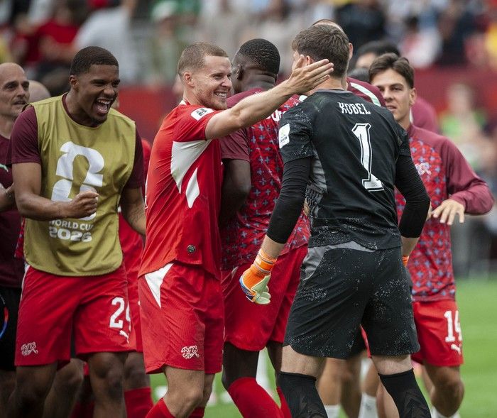 Switzerland players celebrate goalkeeper Gregor Kobel after they won against Colombia in Vancouver during the FIFA World Cup 2026 elimination round Tuesday, July 7, 2026.