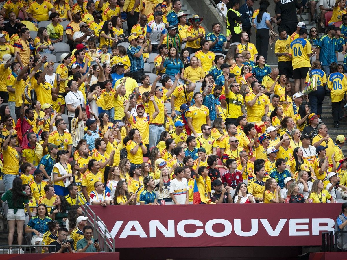 Colombia fans cheer during the first half of play
