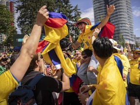 Colombia fans take to the streets around B.C. Place in anticipation of a World Cup round of 16 elimination match between Switzerland and Colombia.