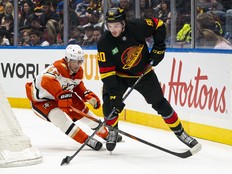 Victor Mancini tries to break away from the check of Nikita Nesterenko on April, 5, 2025 at Rogers Arena.