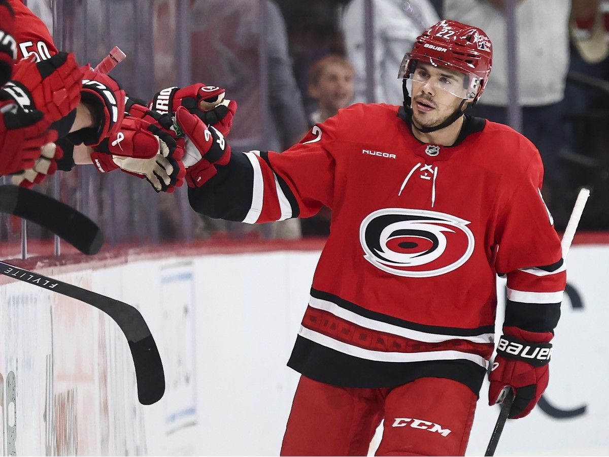 Logan Stankoven of the Carolina Hurricanes celebrates his second goal against the Vancouver Canucks on Oct. 8 in Raleigh. The Kamloops native had a natural hat-trick in a 7-2 win.
