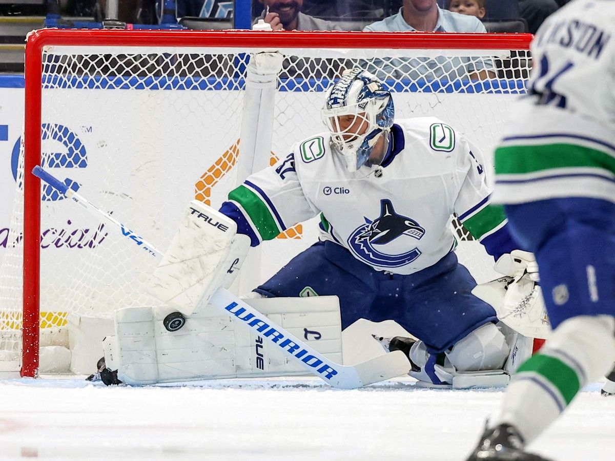 Kevin Lankinen of the Vancouver Canucks makes a save against the Tampa Bay Lightning during the first period at the Benchmark International Arena on October 17, 2026 in Tampa, Florida.