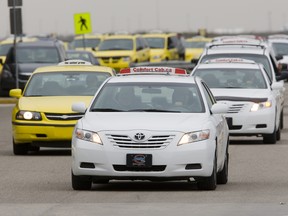 Officials with Comfort Cabs are standing by a driver after video of the man surfaced showing him swinging a snow brush at a passenger.