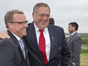 Falling oil prices could affect the cosy relationship between Premier Brad Wall, left, and Mayor Don Atchison.