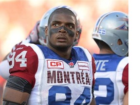 FILE - In this Aug. 7, 2014, file photo, Montreal Alouettes' Michael Sam and teammates warm up for a Canadian Football League game against the Ottawa Redblacks in Ottawa, Ontario. Sam is stepping away from pro football. Sam, the first openly gay player drafted by the NFL, has told the Alouettes that he is leaving the team. He tweeted Friday, Aug. 14, that "The last 12 months have been very difficult for me, to the point where I became concerned with my mental health. Because of this I am going to step away from the game at this time." (Justin Tang/The Canadian Press via AP, File) ORG XMIT: NY160