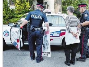 Abortion protester Linda Gibbons is arrested Wednesday in front of the Morgentaler Clinic in Toronto after a silent protest. Abortion barely qualifies as an issue anymore and people like Gibbons are regarded as cranks, writes Christie Blatchford.