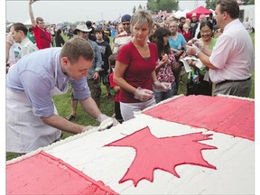 ABOVE AND RIGHT: Canada Day celebrations were held in Diefenbaker Park Wednesday. Above, handing out of the Canada Day cake was among the events taking place.