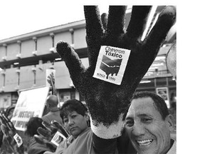 Activists protest against American multinational energy corporation Chevron at a square in Quito, Ecuador, in 2014.